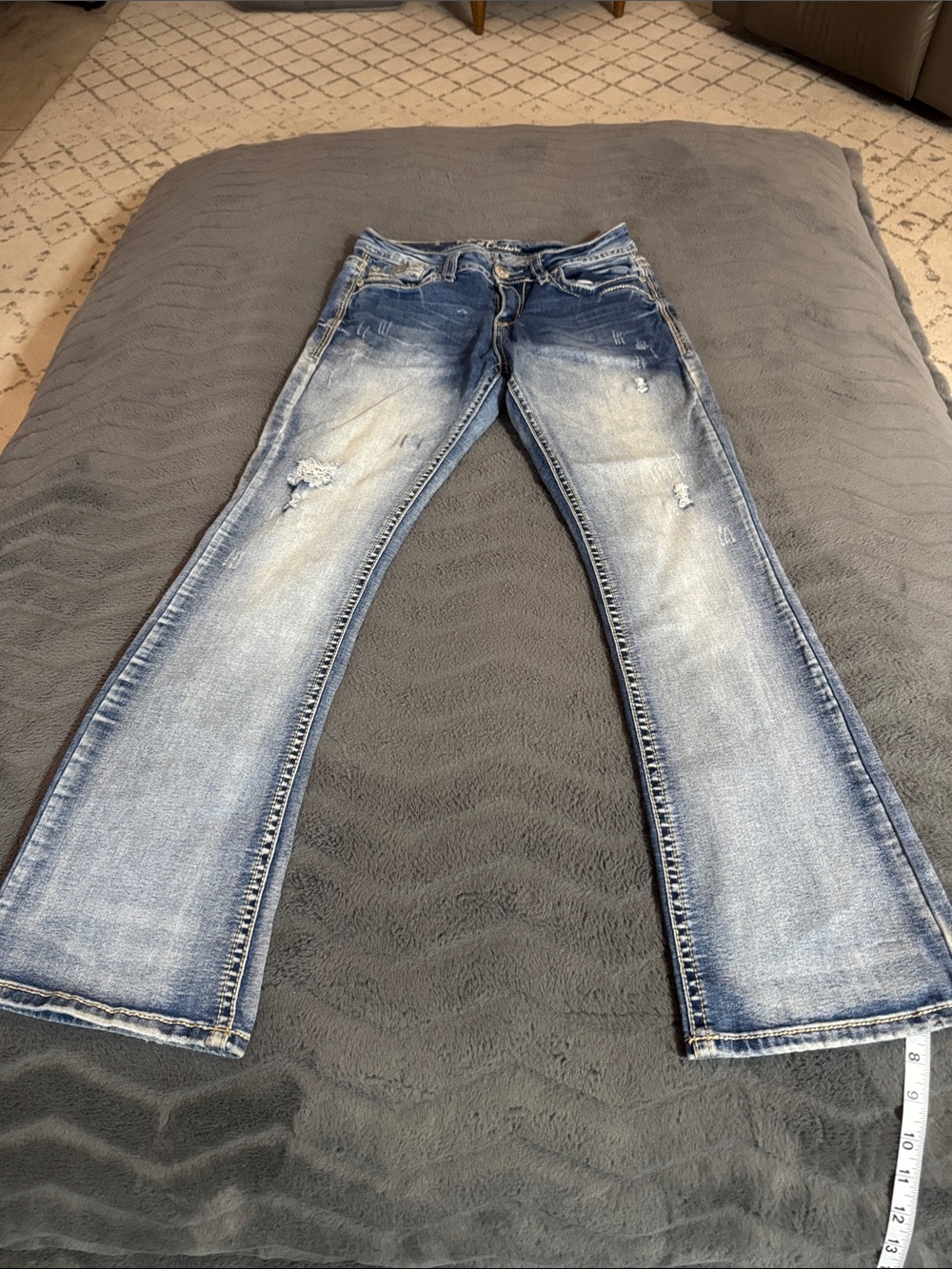 Women’s Light Blue Boot Cut Jeans with Distressed Detailing